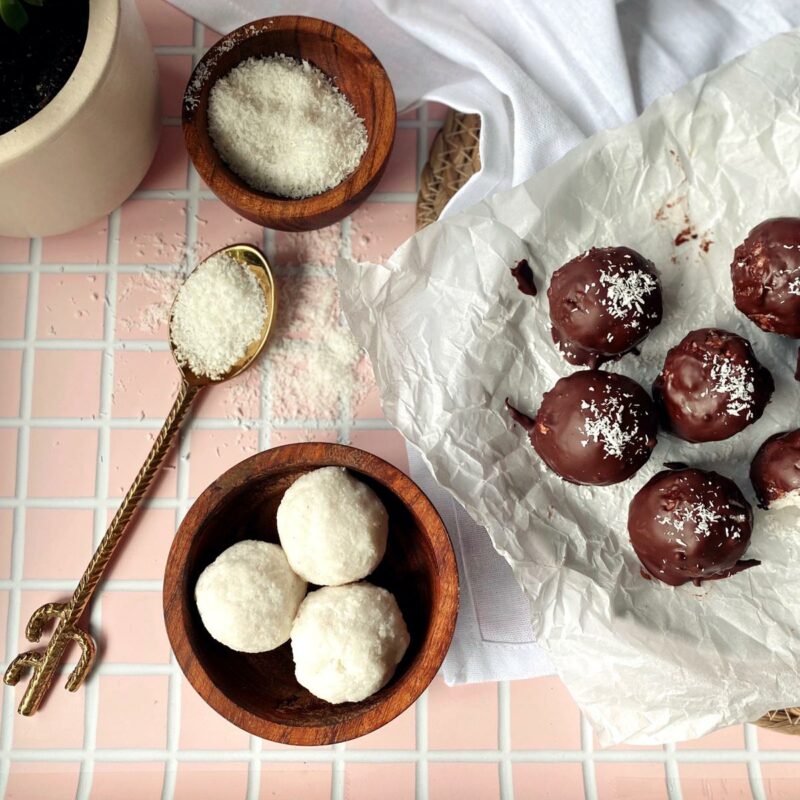 Chocolate covered bounty balls with a sprinkle of salt