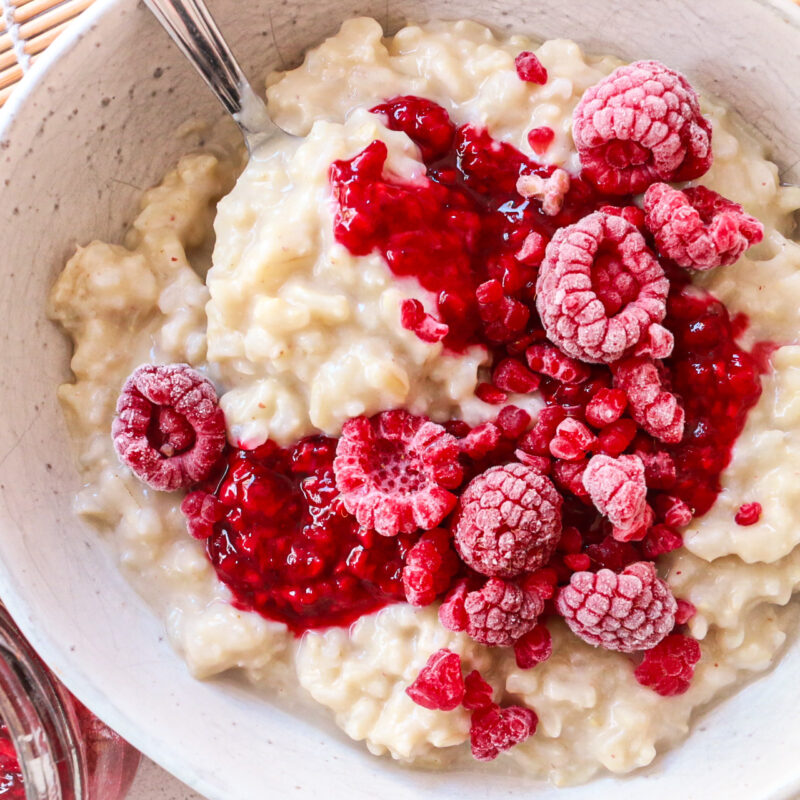 Vanilla Rice Pudding topped with Raspberry Chia Jam in a bowl