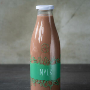 Glass milk bottle filled with chocolate milk