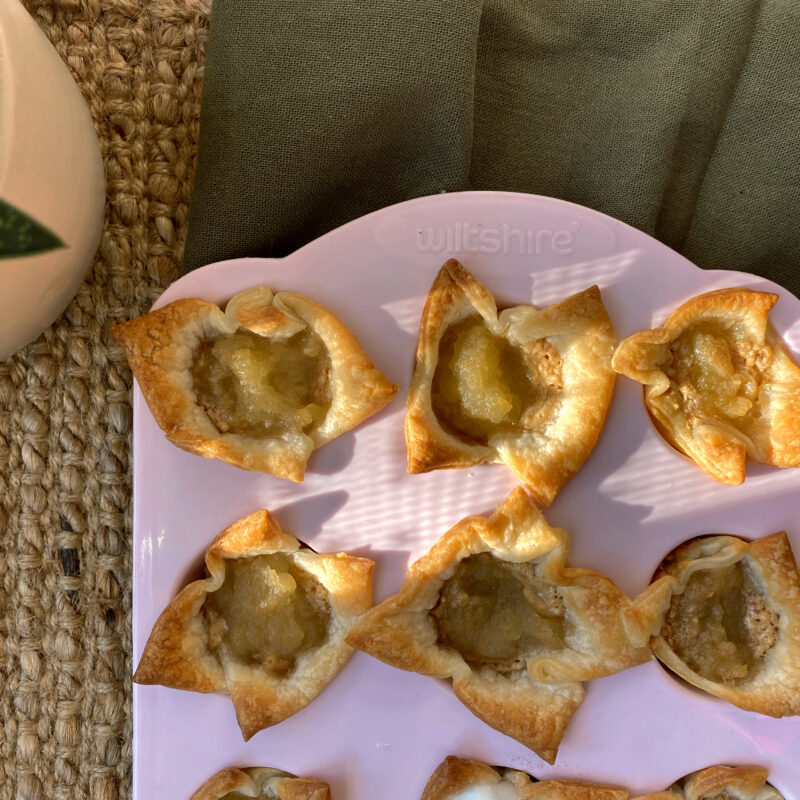 Salted Caramel Apple Pie Bites straight out of the oven in a pink cupcake mould